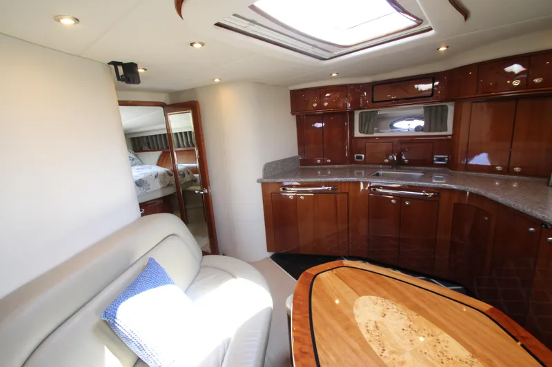  Yacht Photos Pics Luxurious interior of 2003 Sea Ray 550 Sundancer yacht with elegant wood finishes.