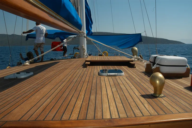 Arinna Yacht Photos Pics Deck of 2006 Aegean Yacht AEGEAN SAILOR 22.50 with blue sails and wooden finish.