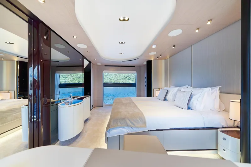  Yacht Photos Pics Luxurious bedroom interior of 2024 Azimut Grande 27 METRI yacht with scenic window view.