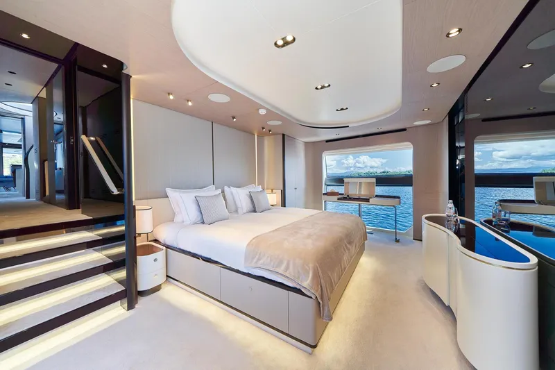  Yacht Photos Pics Luxurious bedroom interior of 2024 Azimut Grande 27 METRI yacht with ocean view.