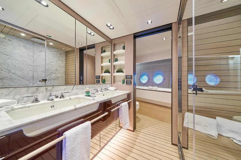  Yacht Photos Pics Luxurious bathroom in 2024 Azimut Grande 27 METRI yacht with marble accents and modern fixtures.