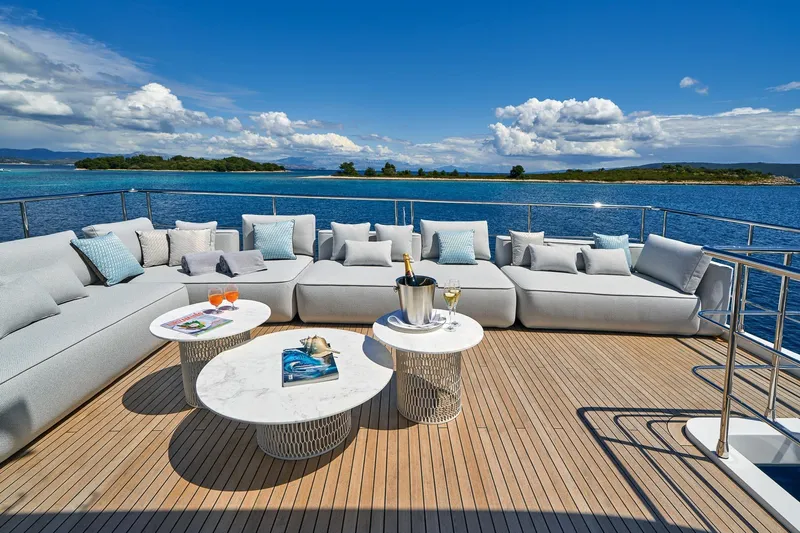  Yacht Photos Pics Luxurious deck of 2024 Azimut Grande 27 METRI yacht with elegant seating and ocean view.