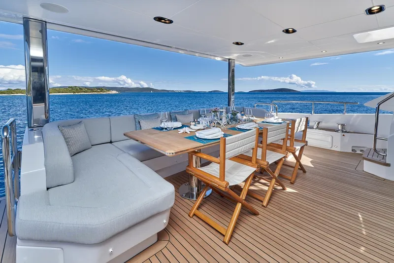  Yacht Photos Pics Luxury dining area on 2024 Azimut Grande 27 METRI yacht with ocean view.
