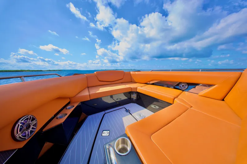  Yacht Photos Pics 2022 Cruisers Yachts 338 South Beach Edition Bow Rider with orange seating under blue sky.