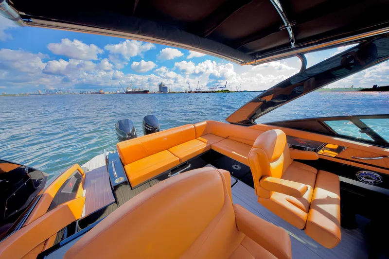  Yacht Photos Pics 2022 Cruisers Yachts 338 South Beach Edition Bow Rider on water, luxurious orange seating.