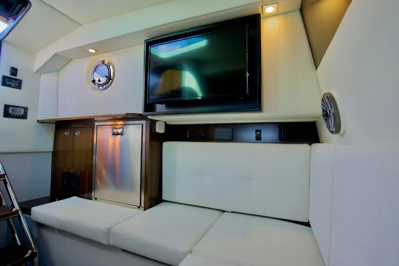  Yacht Photos Pics 2022 Cruisers Yachts 338 South Beach Edition interior with TV and seating area.