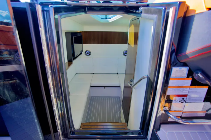  Yacht Photos Pics 2022 Cruisers Yachts 338 South Beach Edition Bow Rider cabin interior with modern seating.