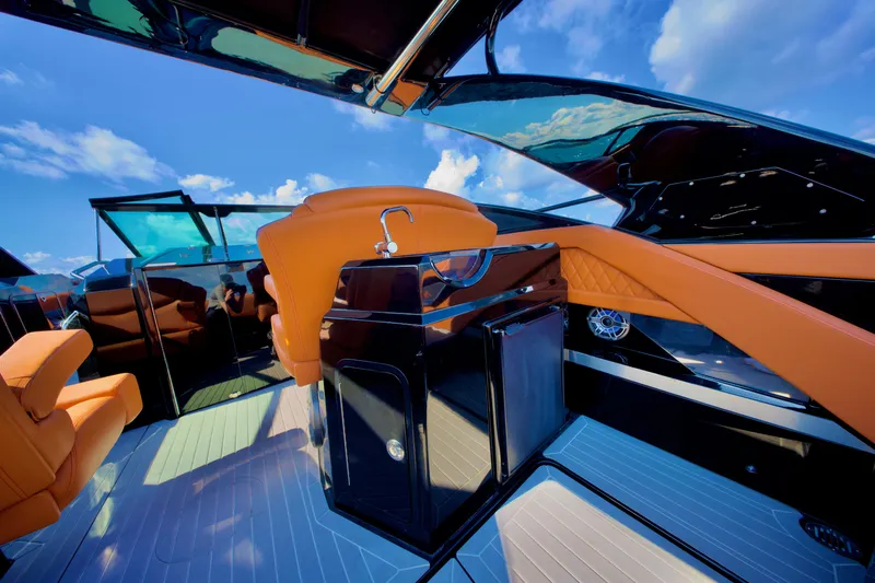  Yacht Photos Pics 2022 Cruisers Yachts 338 South Beach Edition Bow Rider interior with orange seating and sleek design.