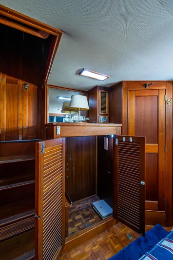 Grande Jete Yacht Photos Pics Interior of 1990 Grand Banks 46 Classic yacht with wooden cabinetry and parquet flooring.