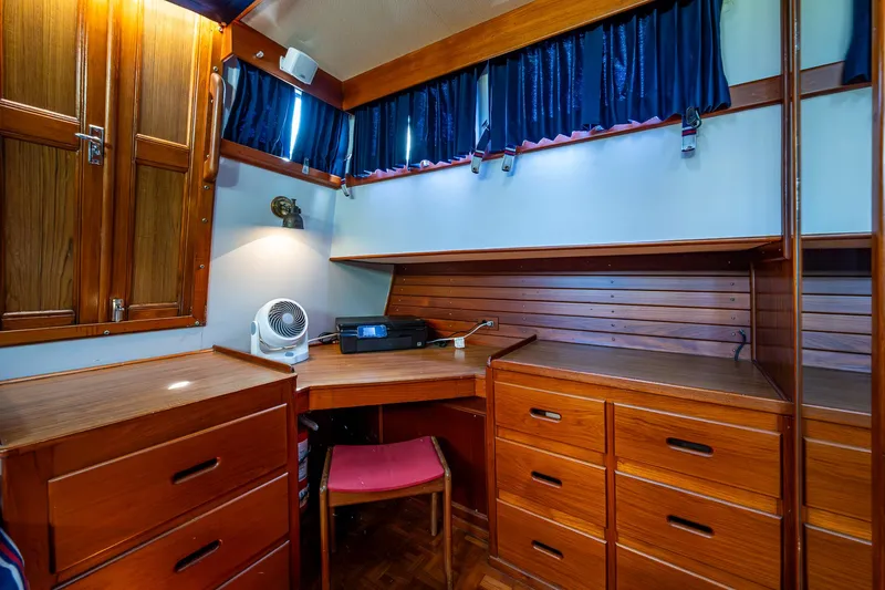 Grande Jete Yacht Photos Pics Cozy wooden interior of 1990 Grand Banks 46 Classic yacht with desk and storage.