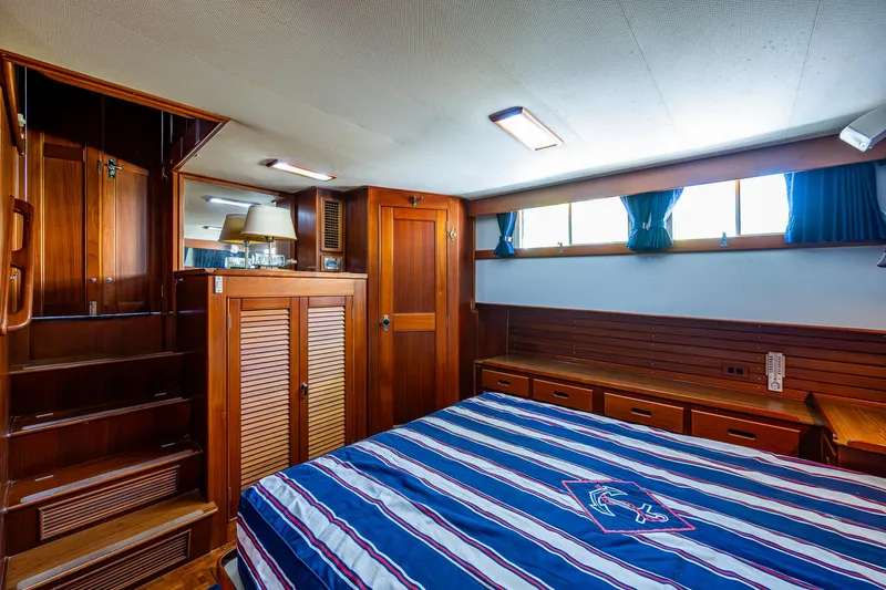 Grande Jete Yacht Photos Pics Luxurious cabin interior of 1990 Grand Banks 46 Classic yacht with wooden furnishings.