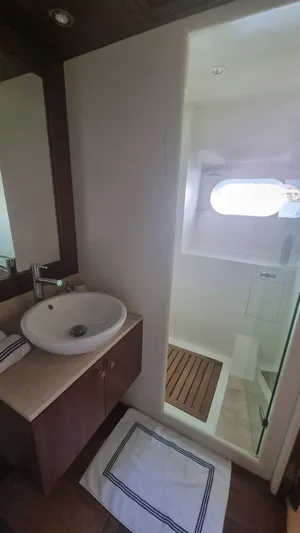 Frienship Yacht Photos Pics Bathroom interior of 2000 Benetti Classic 115 yacht with sink and shower.