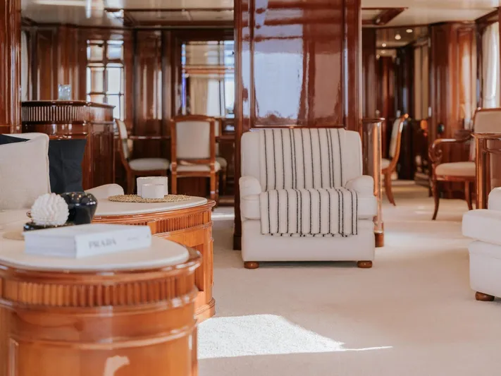 Frienship Yacht Photos Pics Luxurious interior of a 2000 Benetti Classic 115 yacht with elegant wooden furnishings.