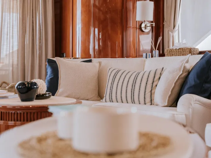 Frienship Yacht Photos Pics Luxurious interior of 2000 Benetti Classic 115 yacht with elegant decor and plush seating.