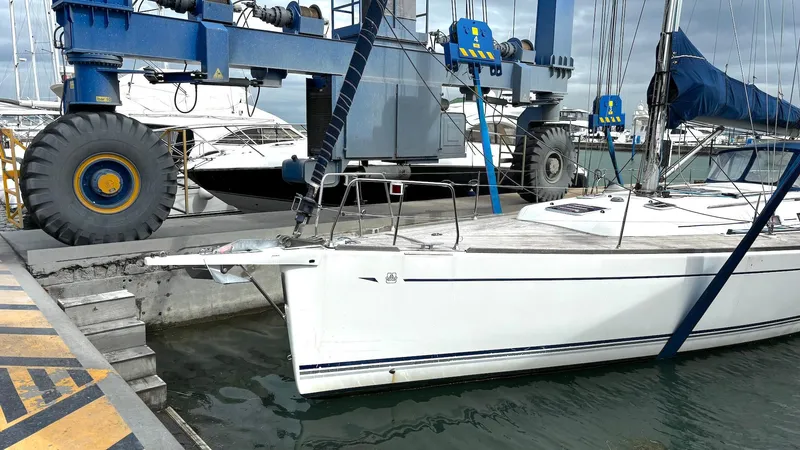 4746 Yacht Photos Pics Sailboat Dufour 44 Performance 2006 docked at marina with lifting equipment.