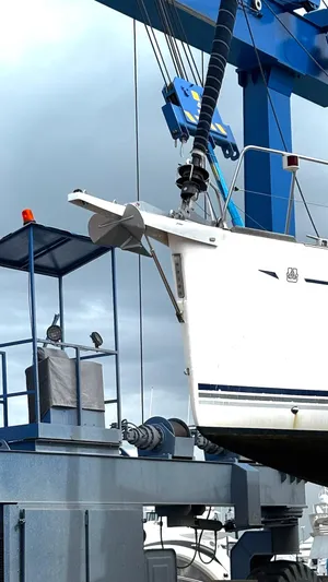 4746 Yacht Photos Pics Dufour 44 Performance yacht from 2006 being lifted by a crane.