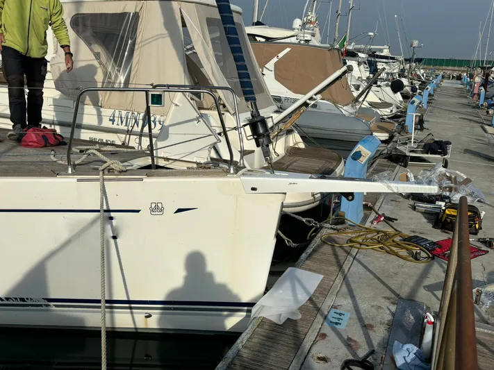 4746 Yacht Photos Pics Docked 2006 Dufour 44 Performance sailboat at marina with visible equipment and shadow.