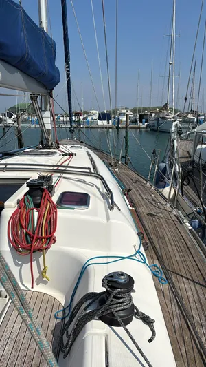 4746 Yacht Photos Pics Sailboat deck view of 2006 Dufour 44 Performance in marina, featuring ropes and winches.