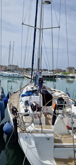 4746 Yacht Photos Pics 2006 Dufour 44 Performance sailboat docked in a marina, featuring a sleek deck design.