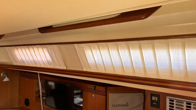 4746 Yacht Photos Pics Interior of 2006 Dufour 44 Performance yacht with curtains and Garmin equipment.