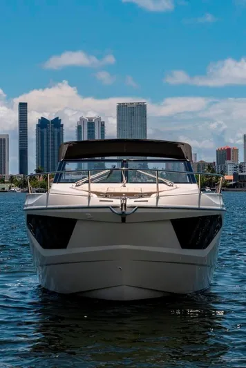 Amaretto Yacht Photos Pics 2015 Absolute 40 STL yacht cruising with city skyline backdrop.