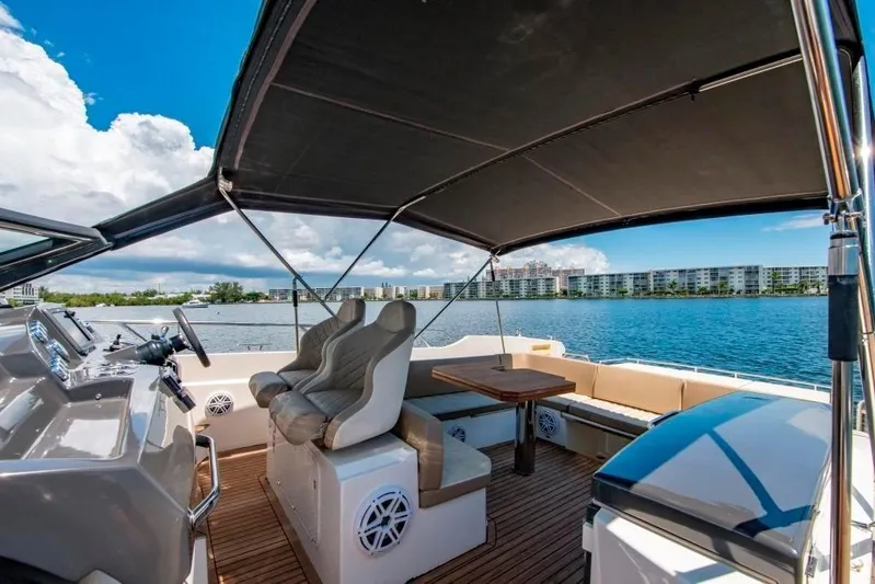 Amaretto Yacht Photos Pics Interior view of 2015 Absolute 40 STL yacht with seating and table.