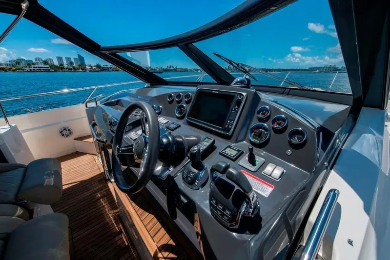 Amaretto Yacht Photos Pics 2015 Absolute 40 STL yacht helm with navigation controls and ocean view.