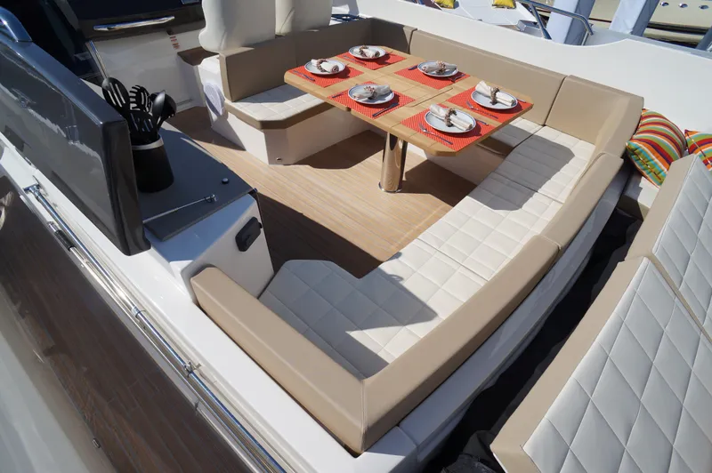 Amaretto Yacht Photos Pics Luxurious seating area on a 2015 Absolute 40 STL yacht, set for dining.