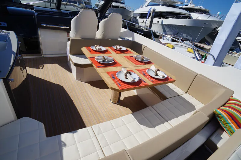 Amaretto Yacht Photos Pics Luxurious dining area on a 2015 Absolute 40 STL yacht, set for four.