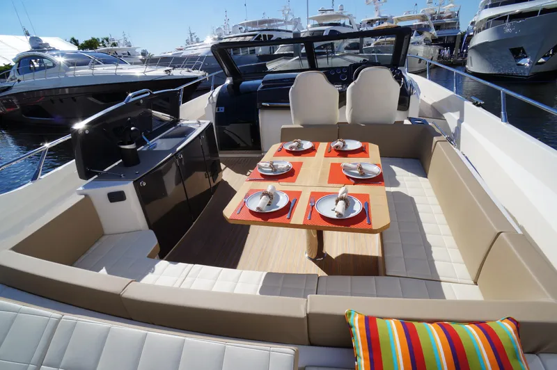 Amaretto Yacht Photos Pics 2015 Absolute 40 STL yacht with elegant dining setup on deck.