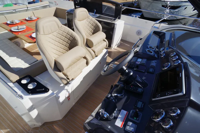 Amaretto Yacht Photos Pics 2015 Absolute 40 STL yacht interior with helm, seating, and dining area.