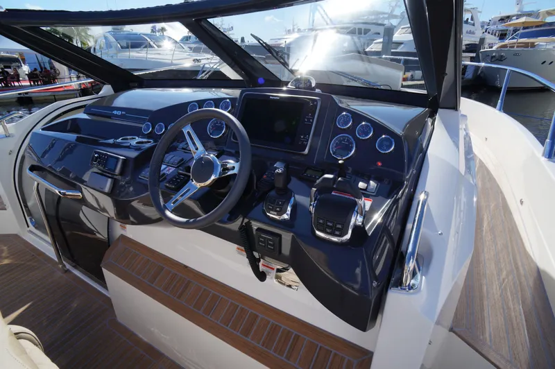 Amaretto Yacht Photos Pics Cockpit of 2015 Absolute 40 STL yacht with modern navigation controls.