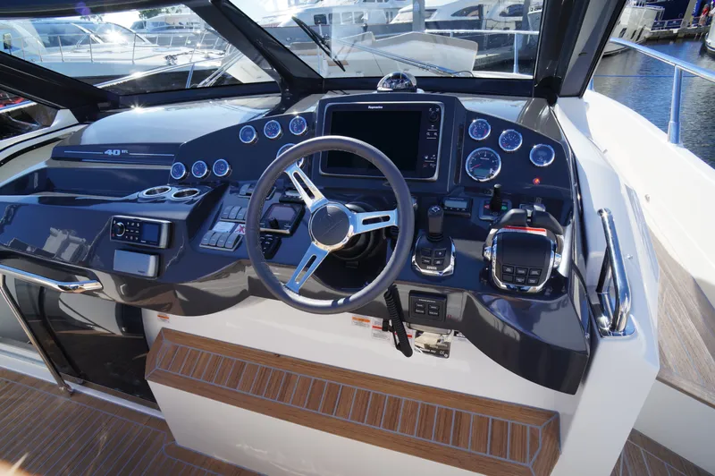 Amaretto Yacht Photos Pics Cockpit of 2015 Absolute 40 STL yacht with modern navigation controls and steering wheel.