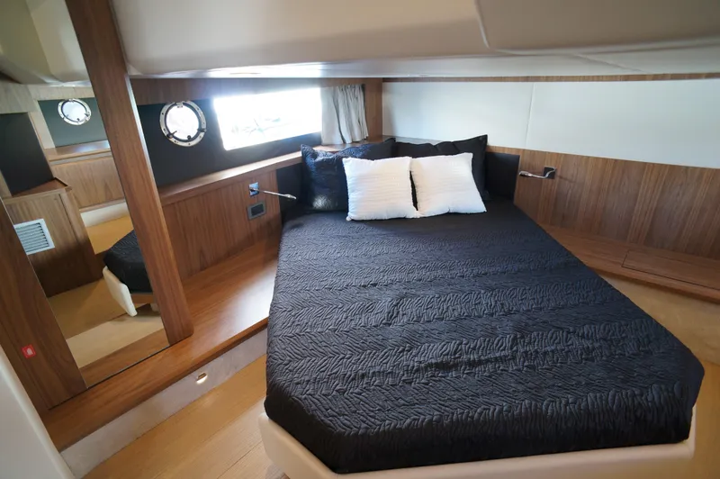 Amaretto Yacht Photos Pics Luxurious bedroom in 2015 Absolute 40 STL yacht with modern wood finish.