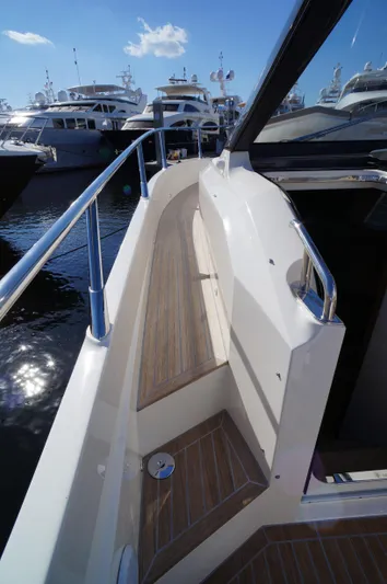 Amaretto Yacht Photos Pics 2015 Absolute 40 STL yacht walkway with wooden deck and stainless steel railings.