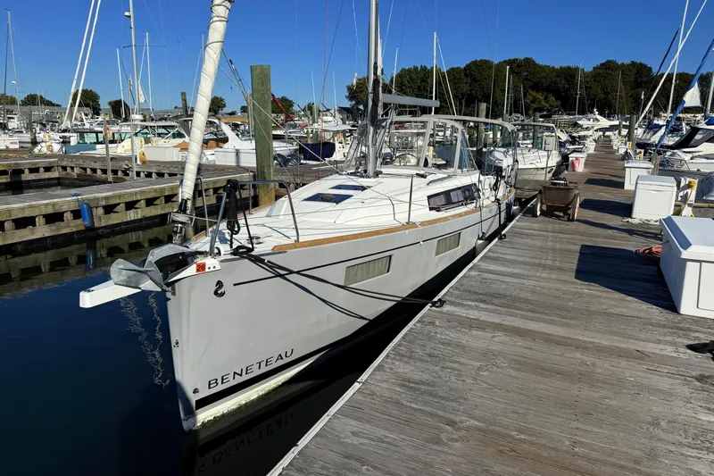  Yacht Photos Pics 2021 Beneteau Oceanis 35.1 yacht docked at marina under clear blue sky.
