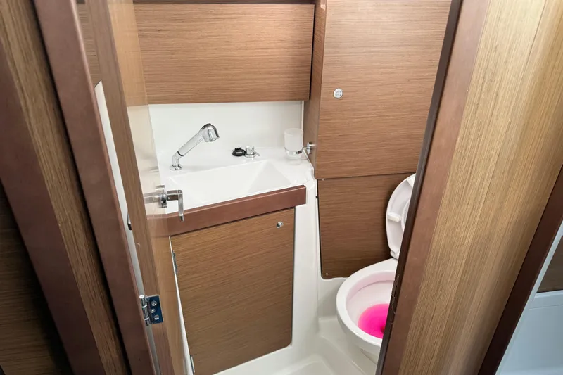  Yacht Photos Pics Beneteau Oceanis 35.1 2021 yacht bathroom with wooden finish and modern fixtures.