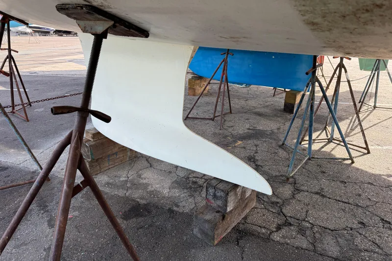  Yacht Photos Pics Keel of 2021 Beneteau Oceanis 35.1 sailboat on stands in a boatyard.