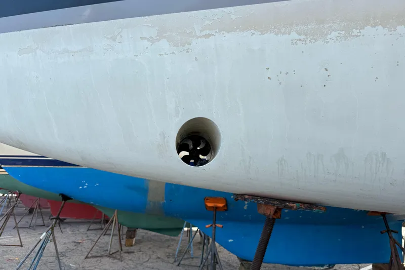  Yacht Photos Pics Beneteau Oceanis 35.1 (2021) hull with visible bow thruster in dry dock.