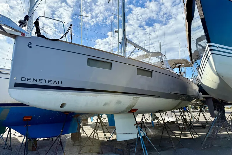  Yacht Photos Pics 2021 Beneteau Oceanis 35.1 sailboat on dry dock under a blue sky.