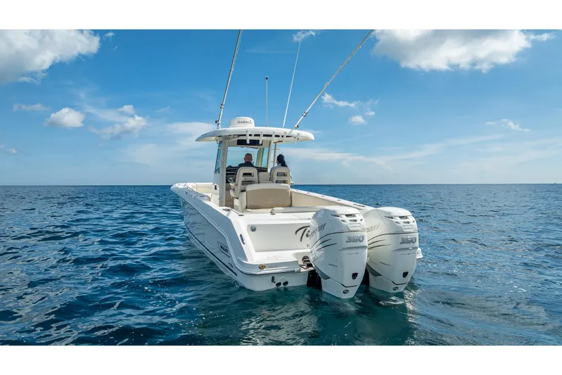 330 Boston Whaler Yacht Photos Pics 2017 Boston Whaler 330 Outrage boat on open sea with twin Mercury engines.