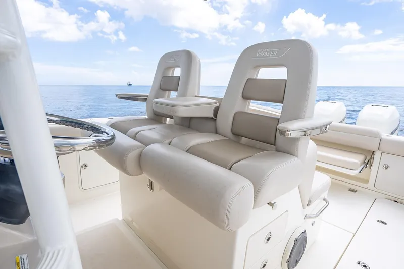 330 Boston Whaler Yacht Photos Pics 2017 Boston Whaler 330 Outrage boat interior with luxurious seating and ocean view.