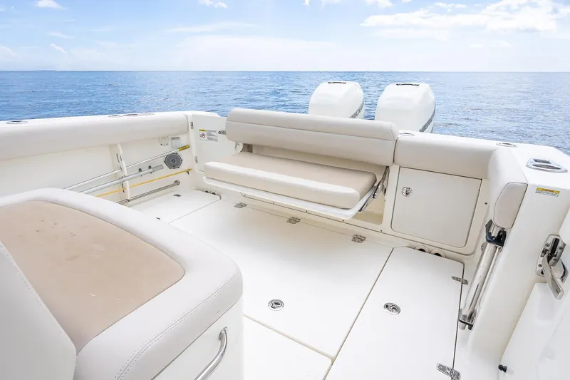 330 Boston Whaler Yacht Photos Pics 2017 Boston Whaler 330 Outrage boat interior with seating, ocean view, and twin engines.