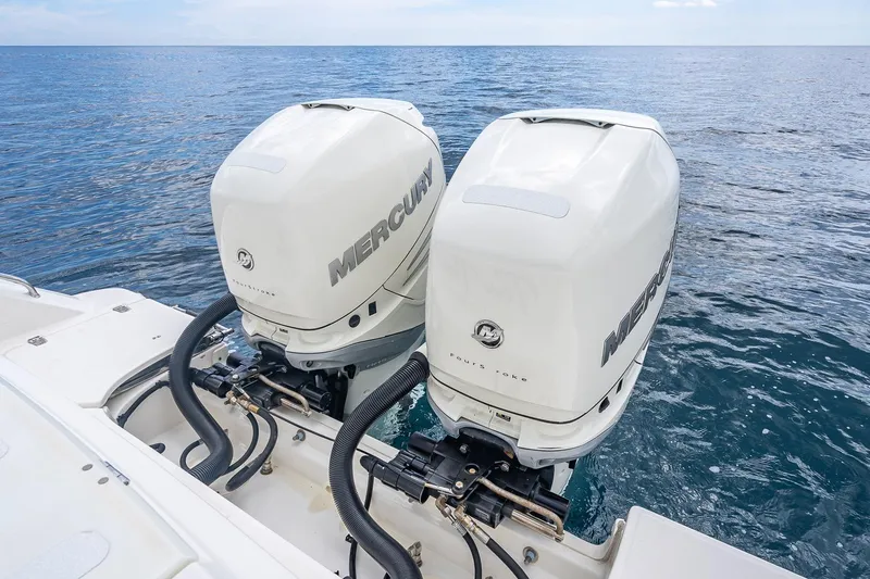 330 Boston Whaler Yacht Photos Pics Twin Mercury outboard engines on a 2017 Boston Whaler 330 Outrage, ocean backdrop.