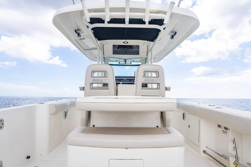 330 Boston Whaler Yacht Photos Pics 2017 Boston Whaler 330 Outrage boat interior with seating and ocean view.