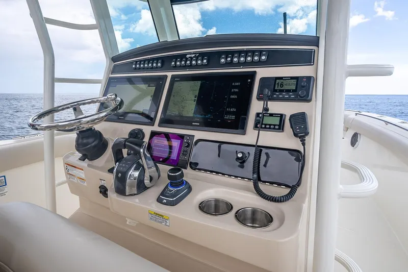 330 Boston Whaler Yacht Photos Pics Control panel of 2017 Boston Whaler 330 Outrage boat with navigation equipment.