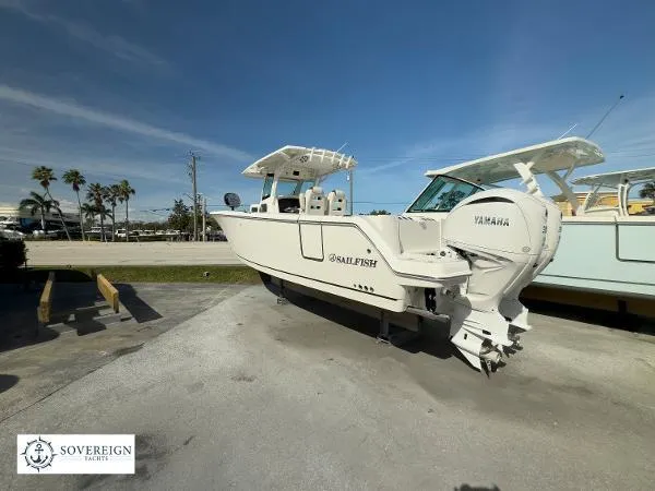 312-027 Yacht Photos Pics 2024 Sailfish 312 boat with Yamaha engine, displayed outdoors under clear blue sky.