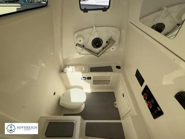 312-027 Yacht Photos Pics 2024 Sailfish 312 boat interior with modern bathroom amenities and sleek design.