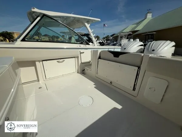 312-027 Yacht Photos Pics 2024 Sailfish 312 boat interior with storage compartments and seating, showcased by Sovereign Yachts.