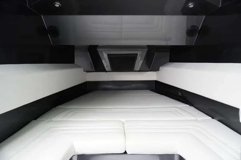 C Daze Yacht Photos Pics Luxurious interior of 2024 Adrenaline 47 Reaper boat with sleek white seating.